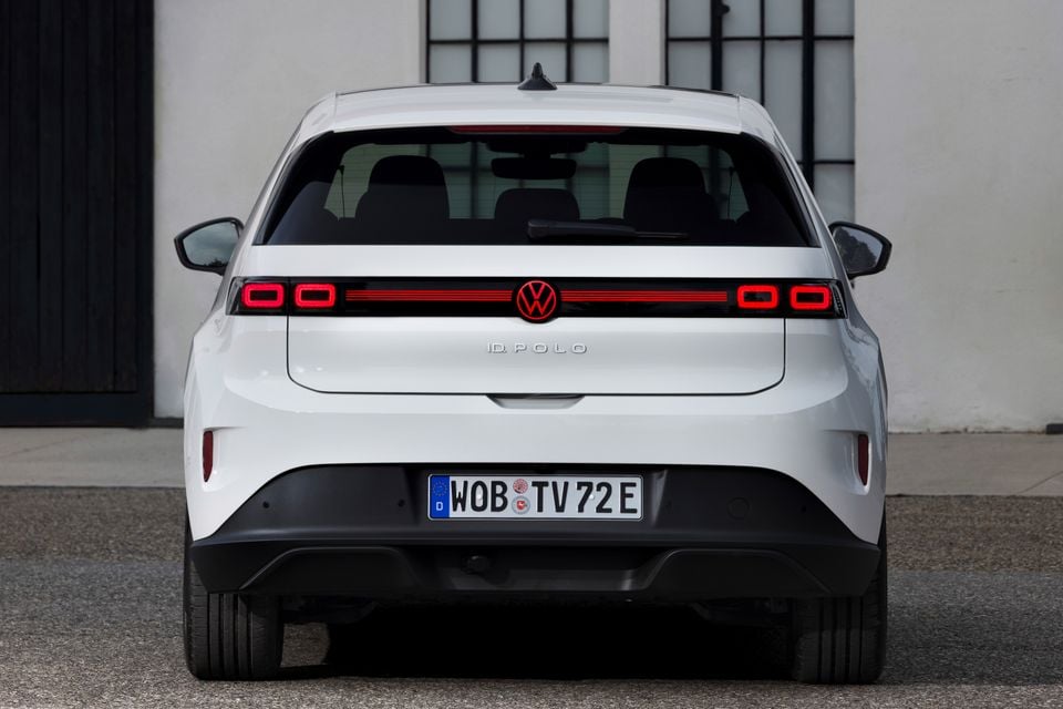 Rear view of a white 2027 Volkswagen ID. Polo showing full-width LED tail-lights and badging