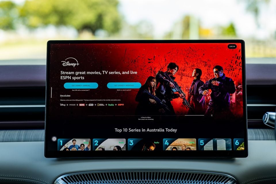 Disney+ streaming service displayed on a large car infotainment touchscreen, showing Top 10 Series in Australia Today
