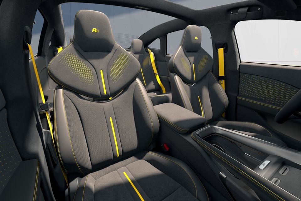 Volkswagen R-Line sports seats with yellow stitching, yellow accent stripes and matching seatbelts inside a car interior
