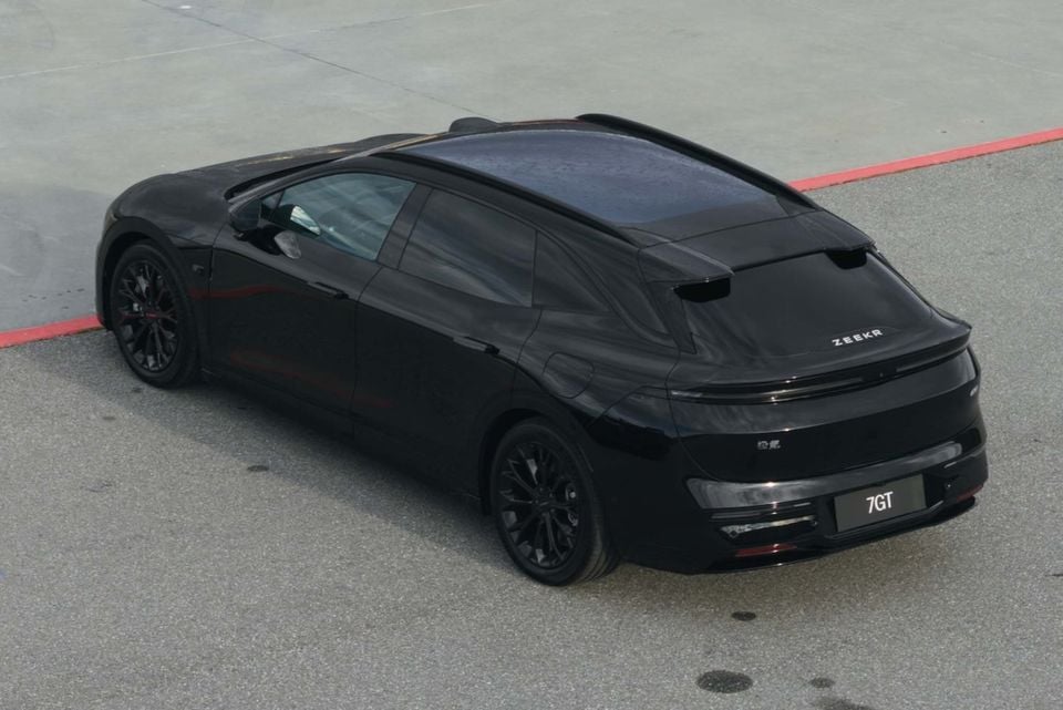 A black Zeekr 7GT shooting brake seen from above and behind, parked on a concrete surface