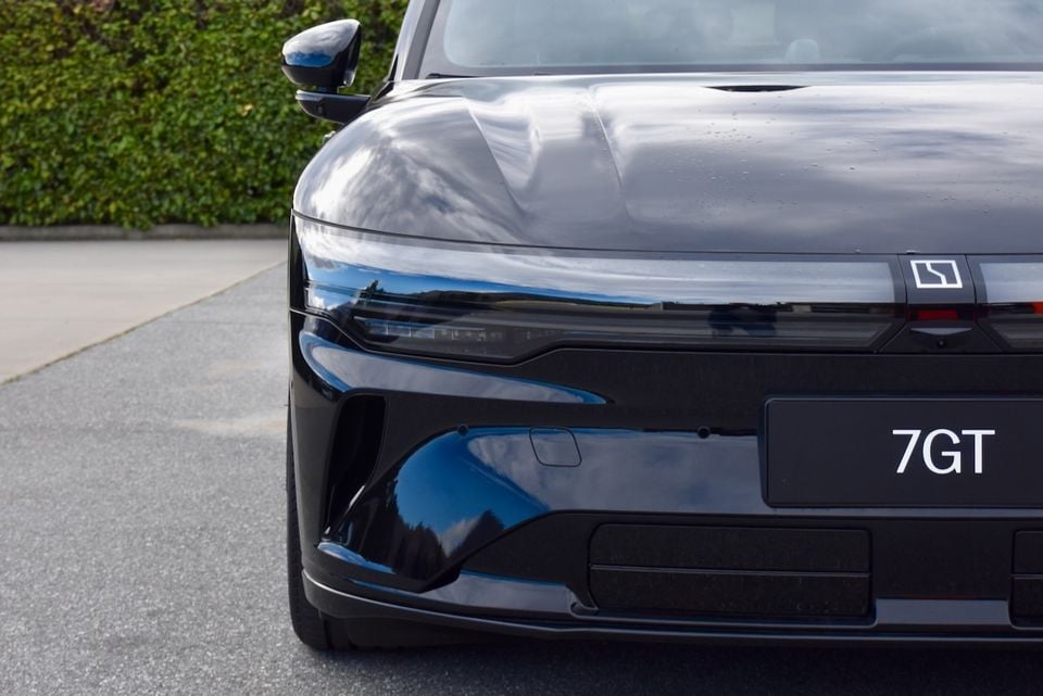 Close-up of the front of a black Zeekr 7GT showing the headlights, bumper and 7GT badge