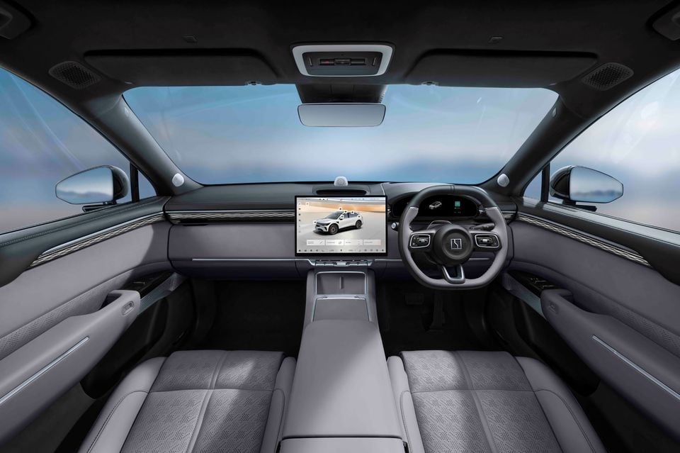Grey cabin of the 2027 Zeekr 7X with right-hand-drive steering wheel, central touchscreen, digital driver display and front seats