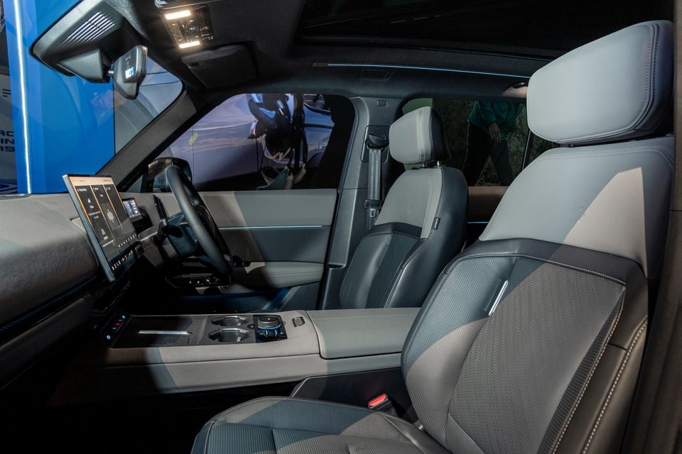 Interior of a 2027 Ford Bronco Basecamp showing the front seats, large touchscreen infotainment display, centre console, and steering wheel