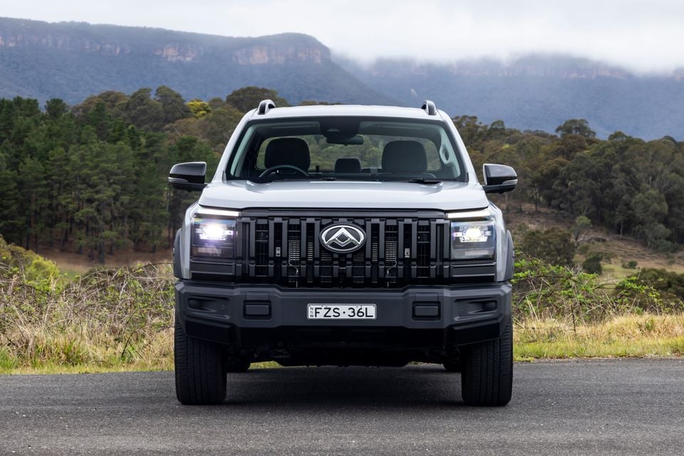 A white 2027 LDV T60 dual-cab ute photographed head-on with mountains in the background.