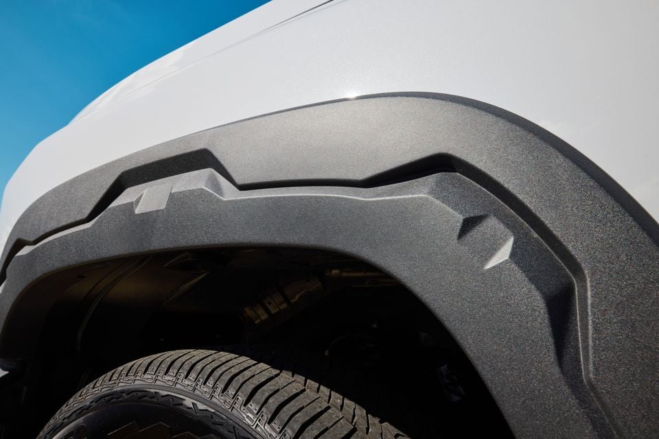 Close-up of the plastic wheel arch flare and tyre on a white 2027 LDV T60 Luxe ute