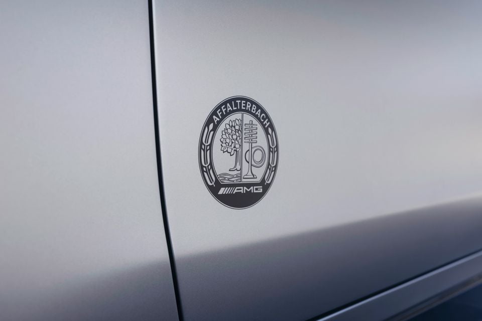 Close-up of the Mercedes-AMG Affalterbach crest badge on the side of a silver car