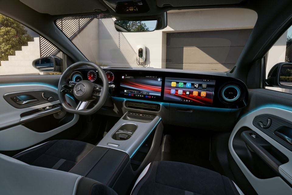 Interior of the 2027 Mercedes-Benz GLA showing the dashboard, large widescreen infotainment display, digital instrument cluster, steering wheel, and front seats