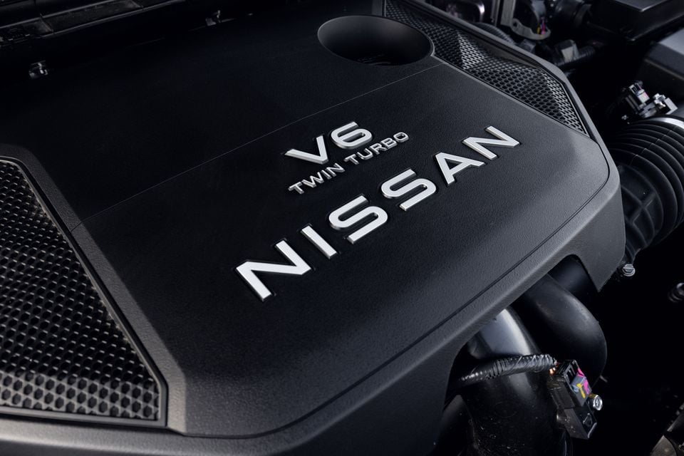 Close-up of a Nissan V6 Twin Turbo engine cover in the engine bay of a 2027 Nissan Patrol Y63