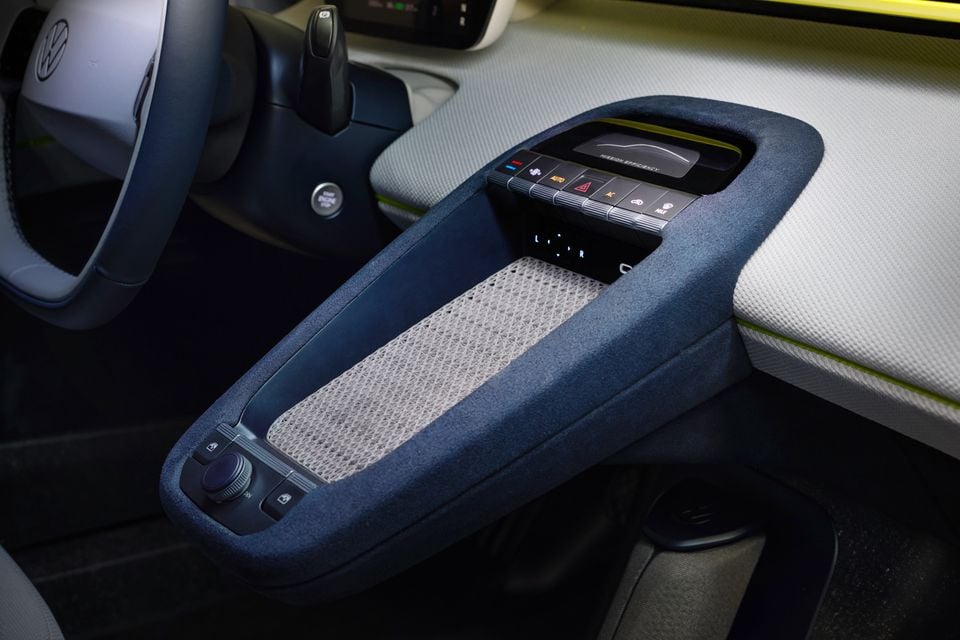 Interior of the Volkswagen ID. Mission Efficiency concept showing the centre console with climate control panel, small display screen, and storage area with textured insert