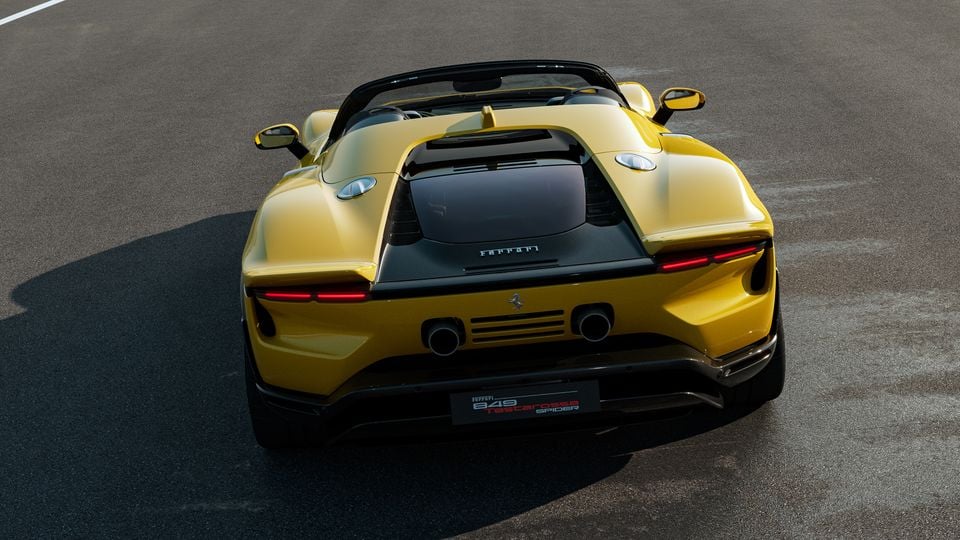 Yellow Ferrari 849 Testarossa Spider seen from the rear, parked on a track surface