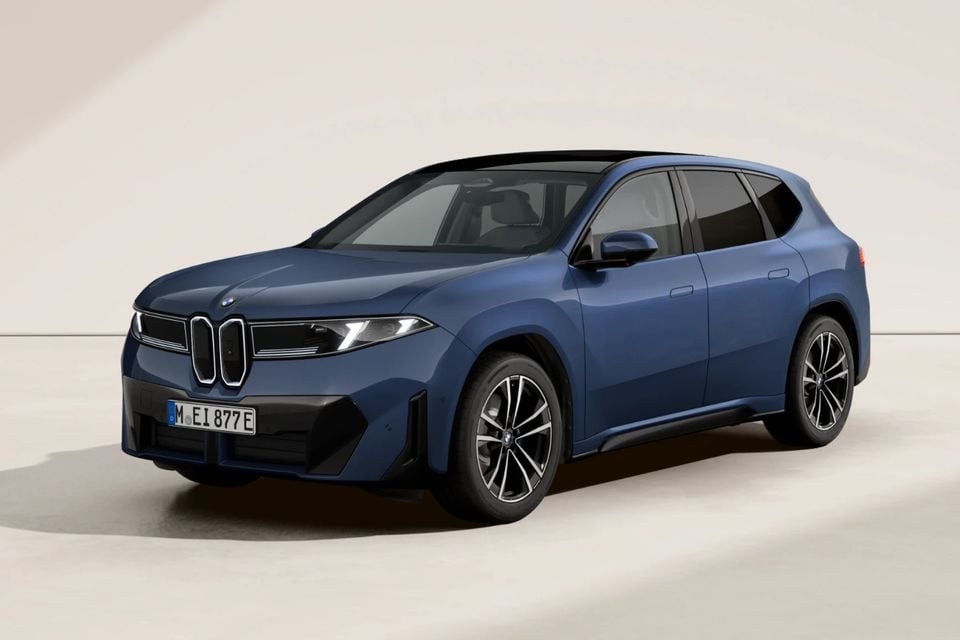 A blue BMW iX3 SUV shown from the front three-quarter angle against a neutral studio background.