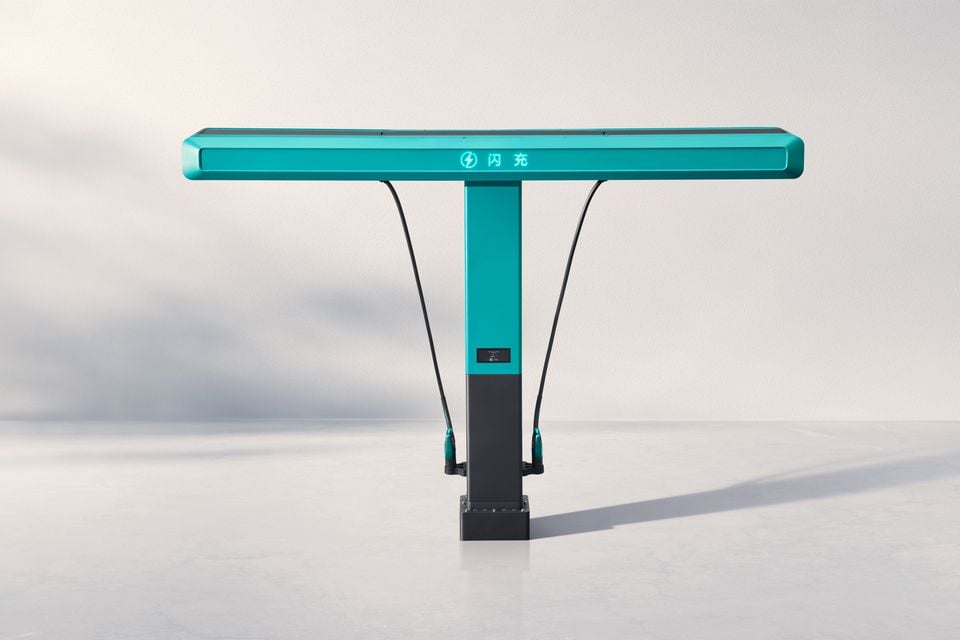 A teal-coloured BYD flash electric vehicle charger with two charging cables, shown against a neutral background