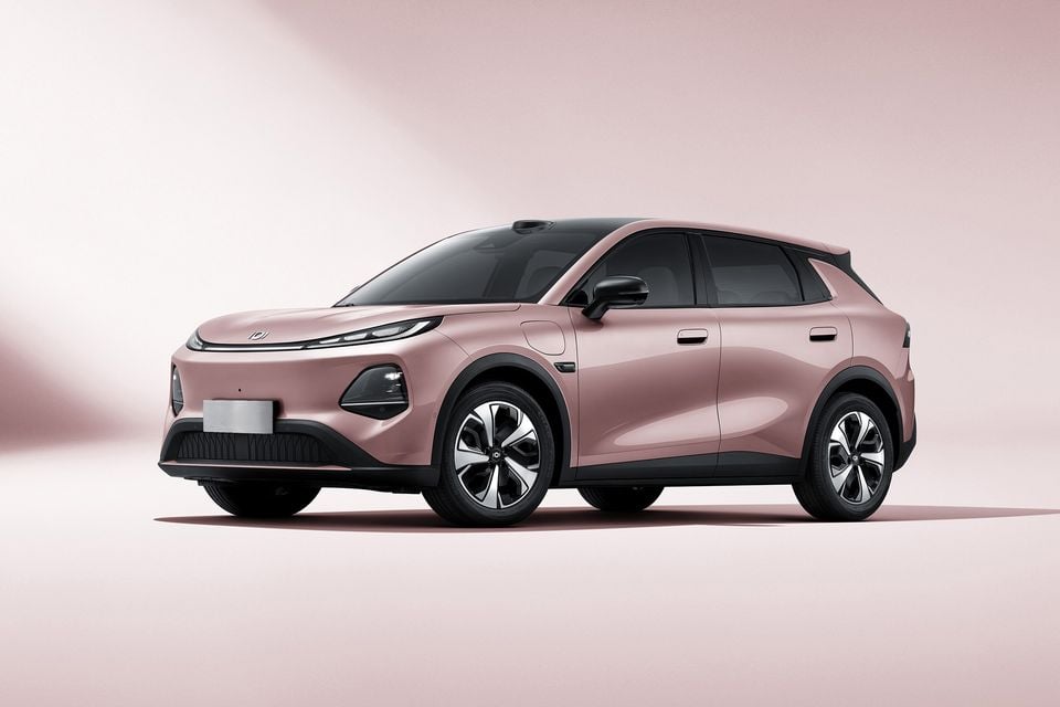 A pink Changan Nevo Q05 electric SUV shown from the front-side angle against a matching pink studio background