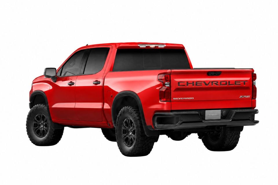 Red Chevrolet Silverado 1500 ZR2 ute seen from the rear three-quarter angle on a white background