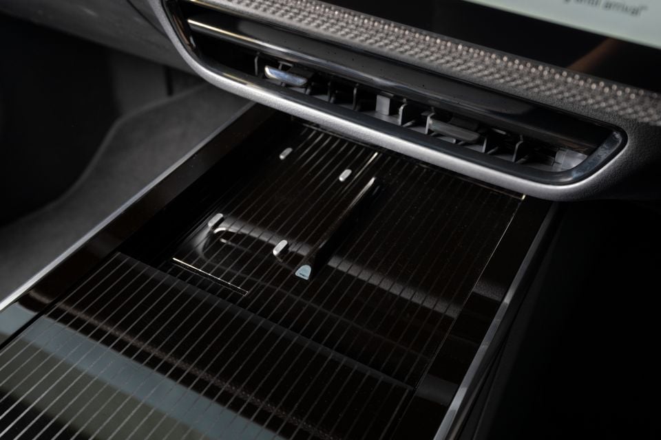 Close-up of the centre console air vents and cup holder area inside a Mazda CX-6e