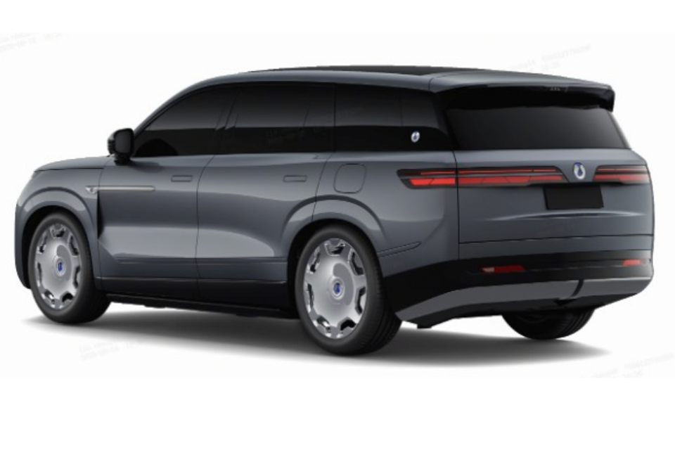 A grey Denza N9 large SUV seen from the rear three-quarter angle, showing its full-width tail-light bar and aero wheels.