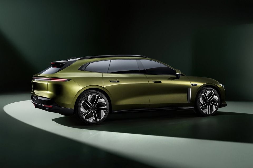 A gold-green Exeed ES7 GT wagon seen from the rear three-quarter angle in a studio setting