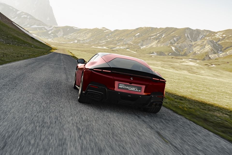 A dark red Ferrari 12Cilindri Manuale coupe seen from the rear, driving along a mountain road with scenic highlands in the background.