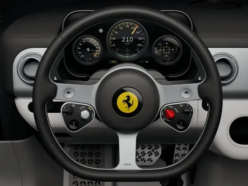 Ferrari Luce steering wheel and instrument cluster, featuring the prancing horse badge, analogue gauges and driving mode controls