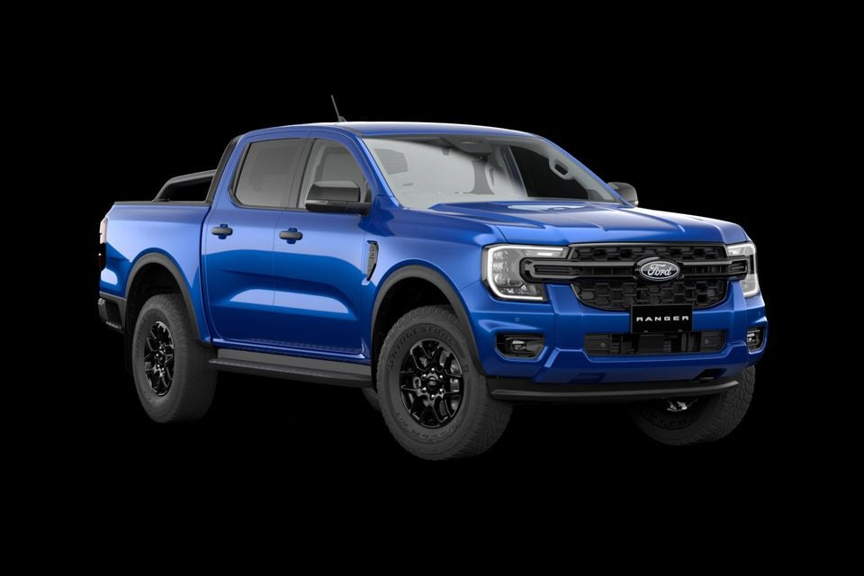 A blue Ford Ranger XLT V6 dual-cab ute seen from the front-side angle against a black background
