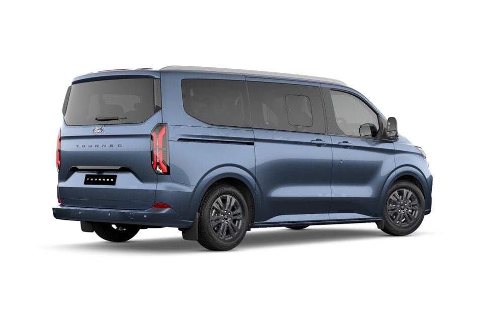 A blue Ford Tourneo van seen from the rear three-quarter angle on a white background