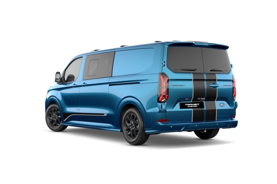 A blue Ford Transit Custom Sport van with black racing stripes, seen from the rear quarter angle on a white background