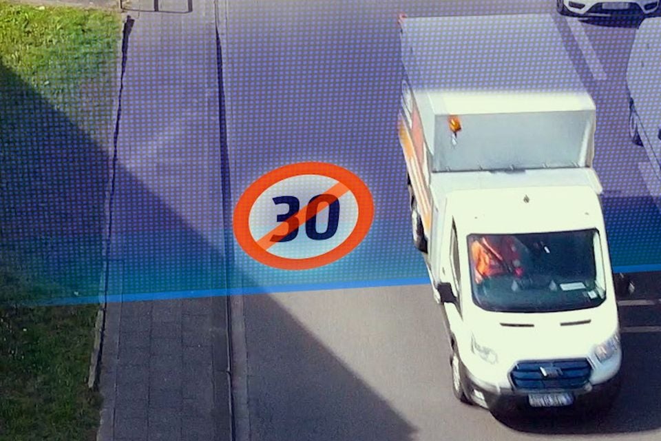 An overhead view of a white van on a road, overlaid with a graphic of a crossed-out 30 speed limit sign, illustrating geofencing speed-limiting technology.