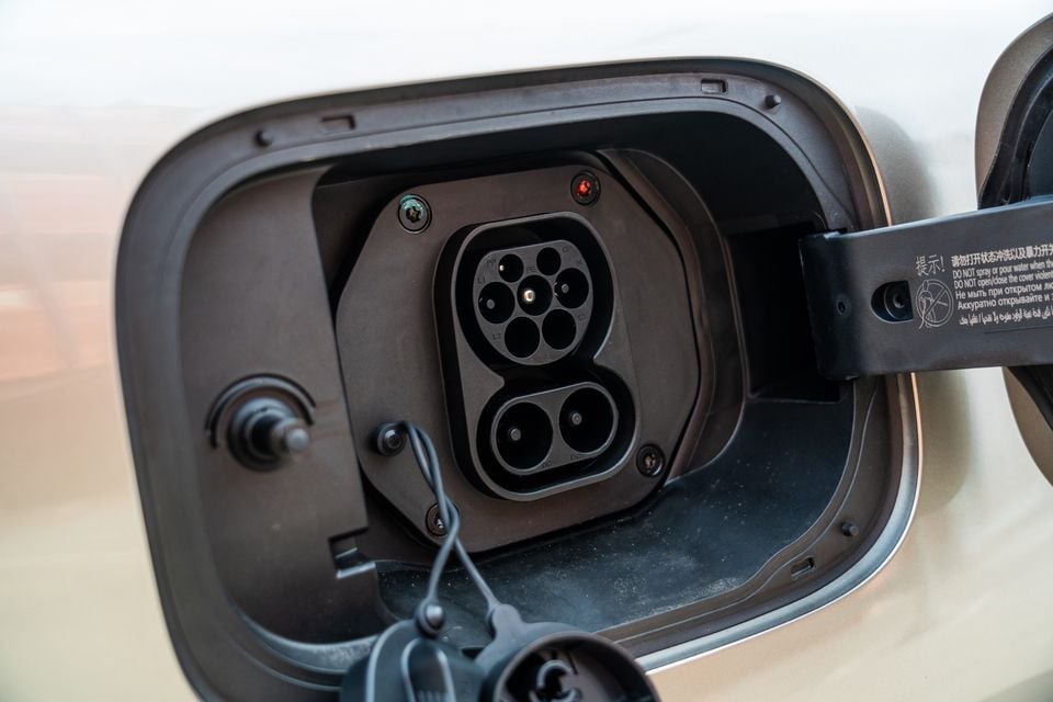 Close-up of a Type 2 combined AC and DC charging port on a GWM Tank 500 Hi4-T PHEV plug-in hybrid vehicle