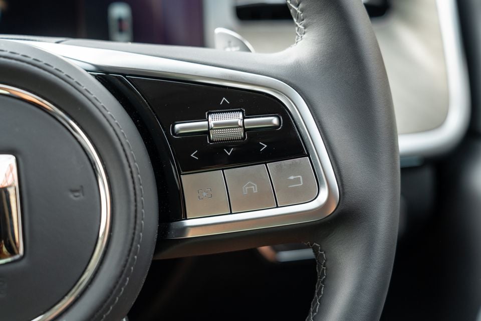 Close-up of the right-side steering wheel controls on a GWM Tank 500 Hi4-T PHEV, showing a scroll dial, directional arrows, and shortcut buttons