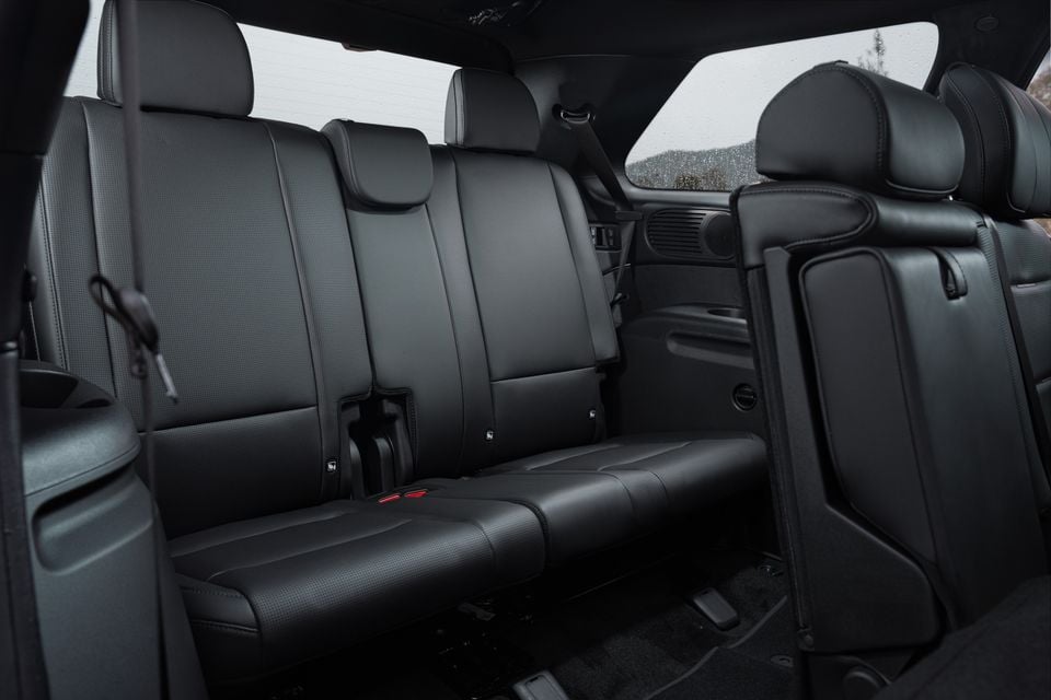 Black leather second-row bench seats in the Hyundai Palisade Calligraphy, with the third-row seats visible to the right