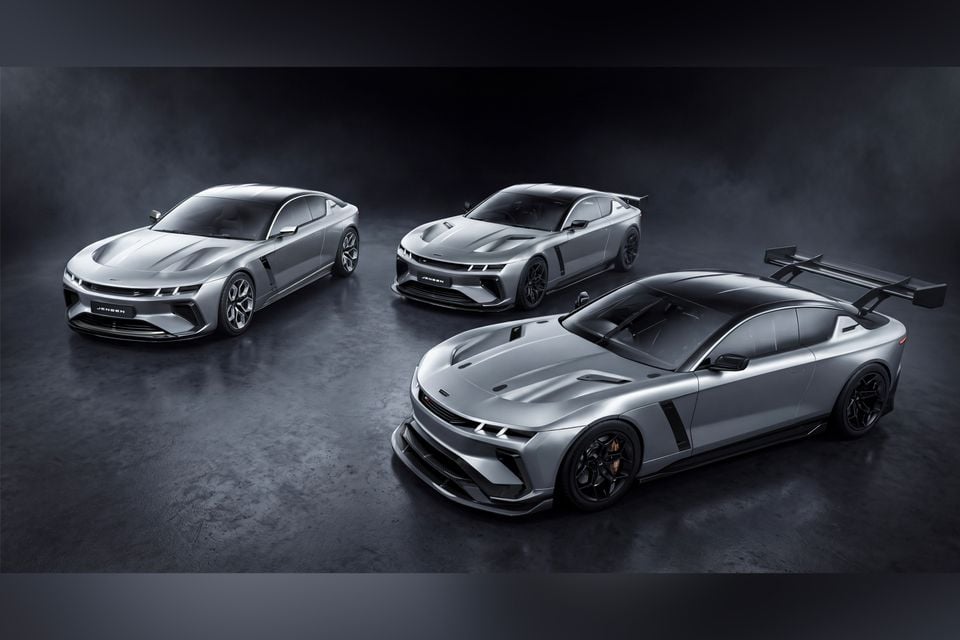 Three Jensen Interceptor sports cars in silver displayed together in a studio setting, showing different variants including a standard model, a performance version, and a track-focused model with a large rear wing
