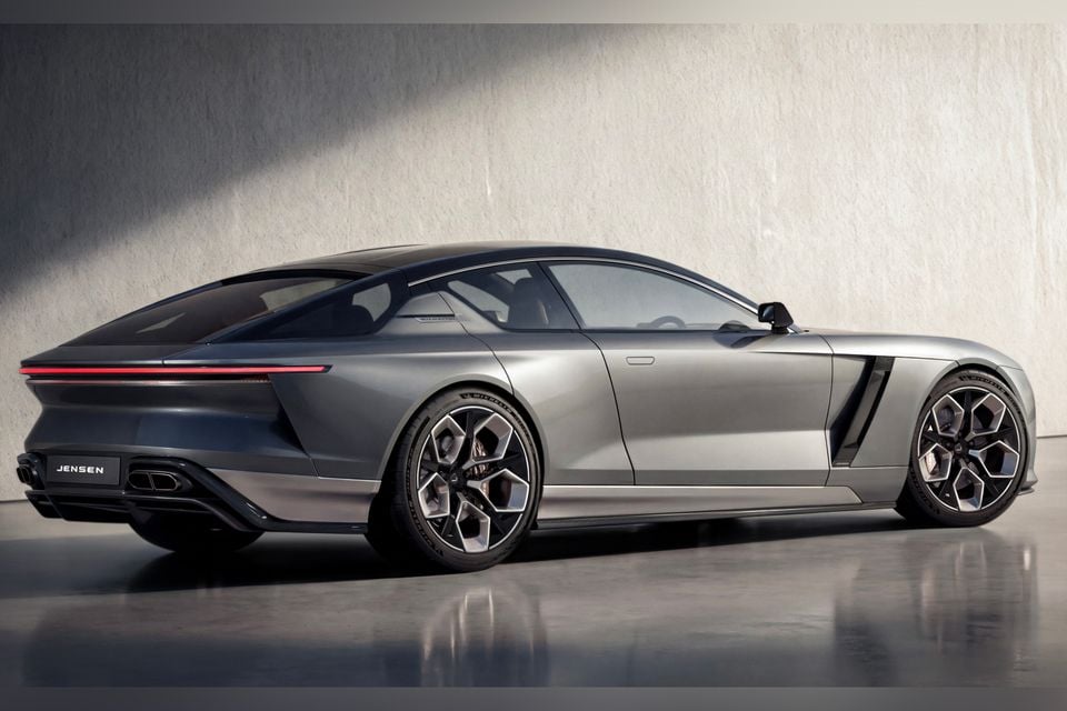 A Jensen Interceptor GT gran turismo coupe in silver, seen from the rear three-quarter angle in a studio setting