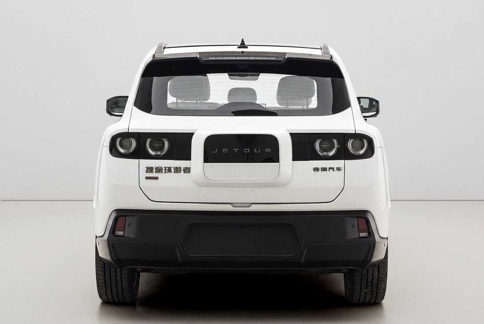 Rear view of a white Jetour TX SUV photographed against a studio background