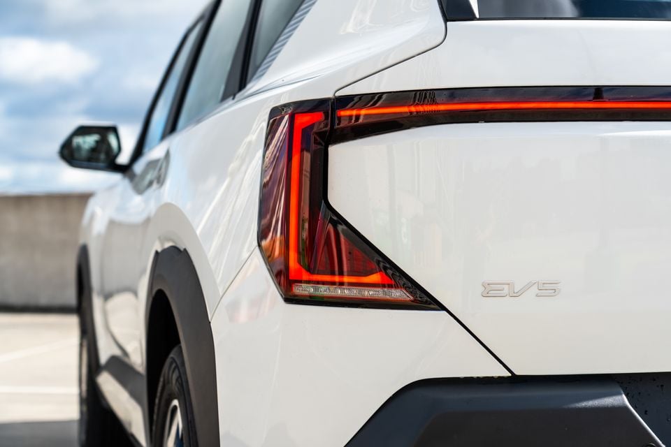 Close-up of the rear tail light and EV5 badge on a white Kia EV5 SUV