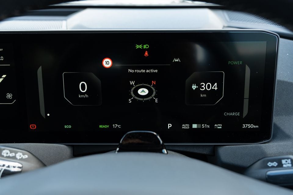 The digital instrument cluster of a Kia EV5 showing 0 km/h speed, 304 km electric range, a compass, ECO mode, and 51% battery charge on a dark display screen.