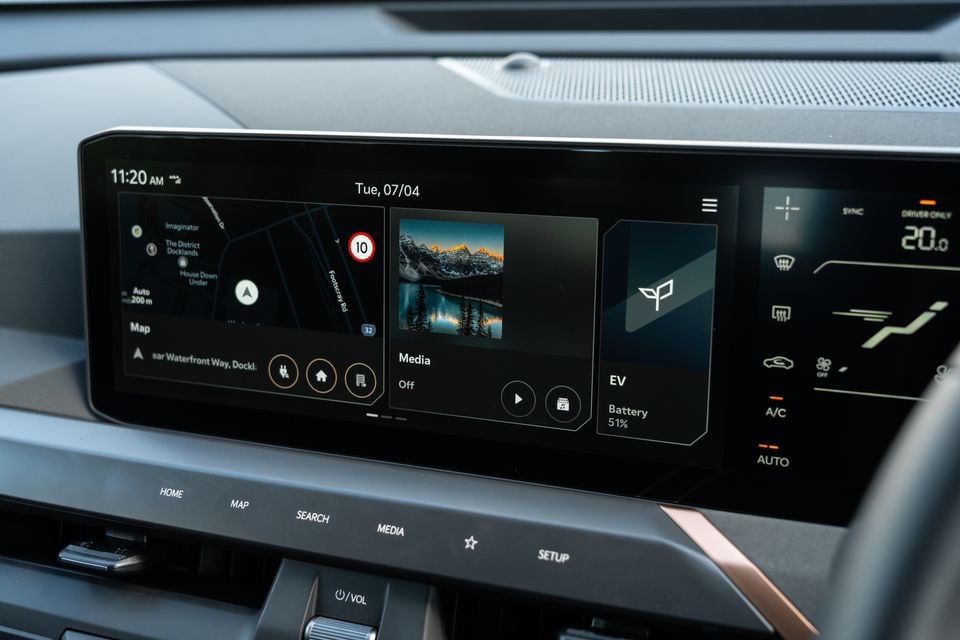 Kia EV5 infotainment touchscreen showing navigation map, media player and EV battery status at 51%, with climate controls to the right
