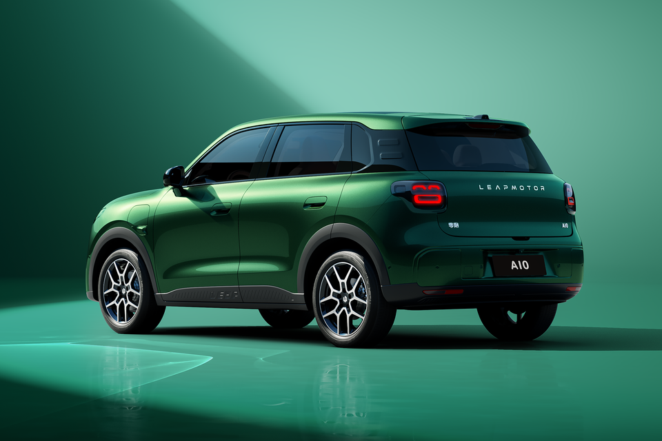 A green Leapmotor A10 small SUV seen from the rear three-quarter angle in a studio setting