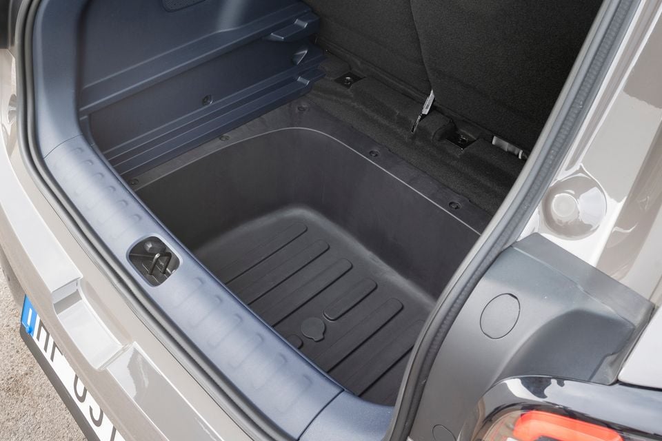 Open boot of a grey Leapmotor B03X showing a deep underfloor storage tub with the cargo floor removed