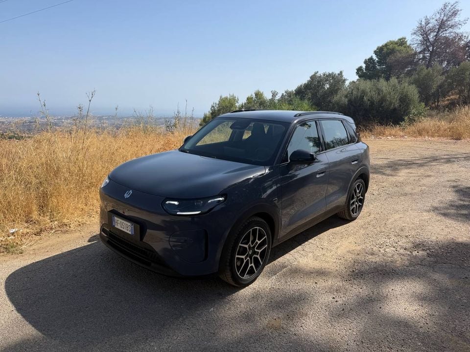 Leapmotor B03X viewed from the front three-quarter angle beside a mountain road