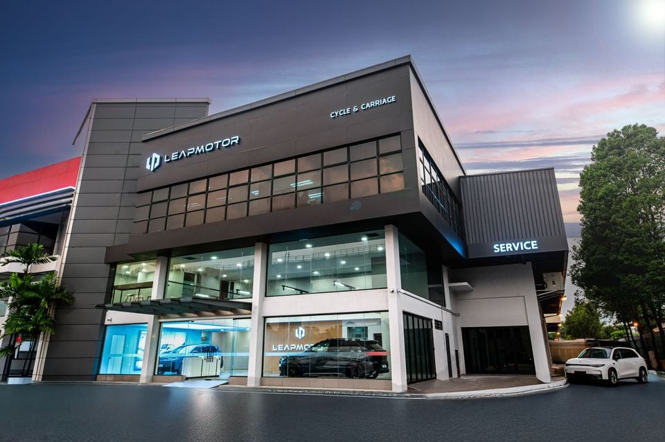 The Leapmotor dealership and service centre operated by Cycle & Carriage, photographed at dusk with cars displayed in the showroom windows.
