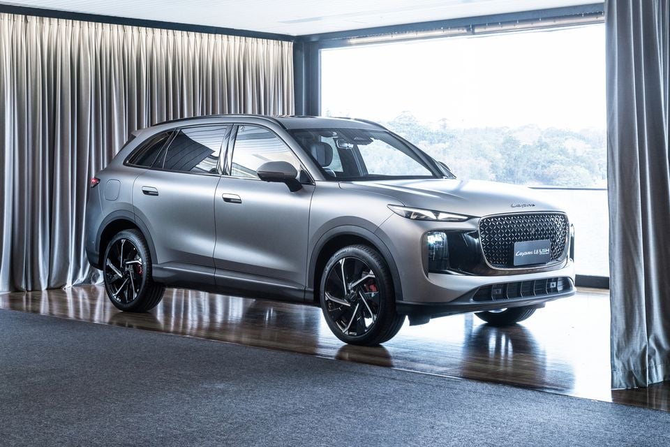A silver Lepas L8 LSH SUV displayed indoors, seen from the front-side angle