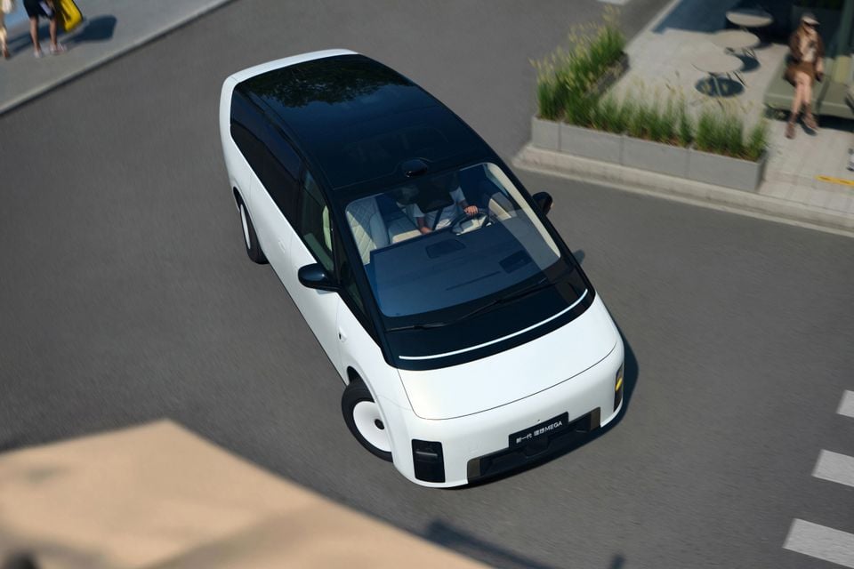 A white Li Auto Mega electric MPV seen from above driving on a street