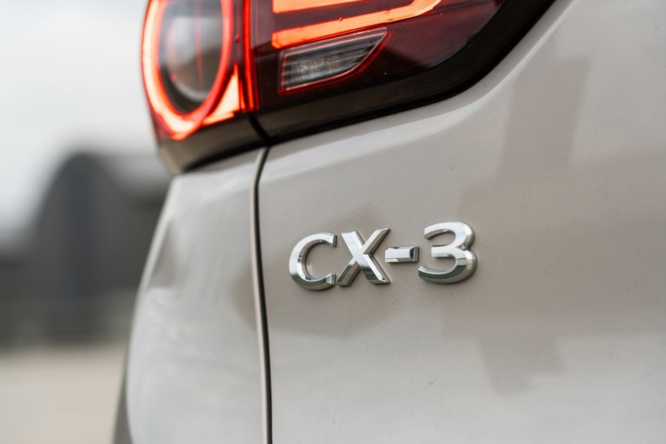 Close-up of the CX-3 badge and tail light on the rear of a Mazda CX-3
