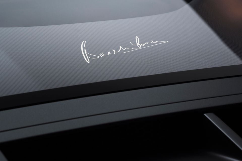 Close-up of a carbon fibre panel on a McLaren MCL36GT featuring a white designer signature