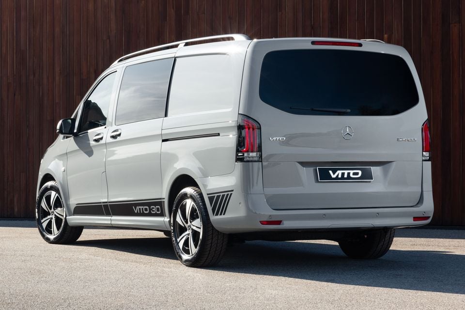 A silver Mercedes-Benz Vito 30th Anniversary edition van seen from the rear three-quarter angle, featuring dark side graphics and alloy wheels