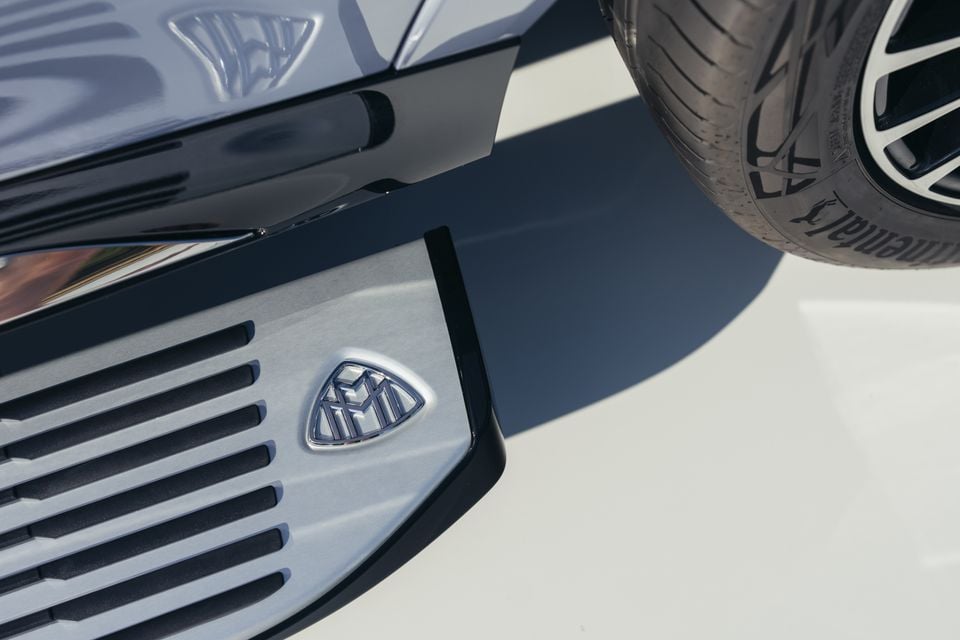 Close-up of the Maybach badge and front grille of a Mercedes-Maybach GLS 680, with a front tyre visible in the upper right corner.