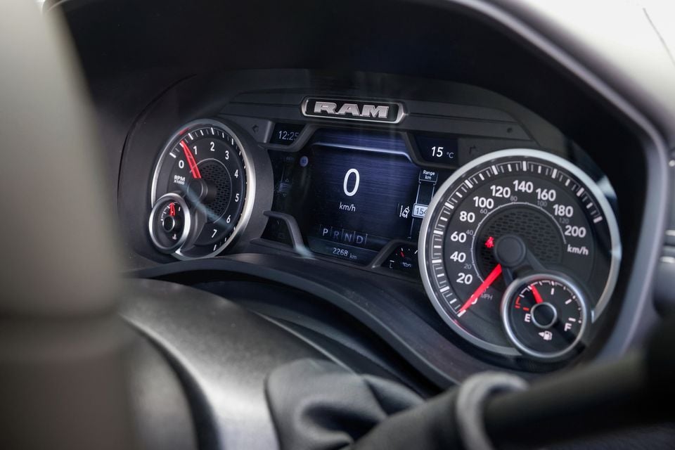 Close-up of the RAM 2500's instrument cluster showing the speedometer, tachometer, digital display and gear selector indicator