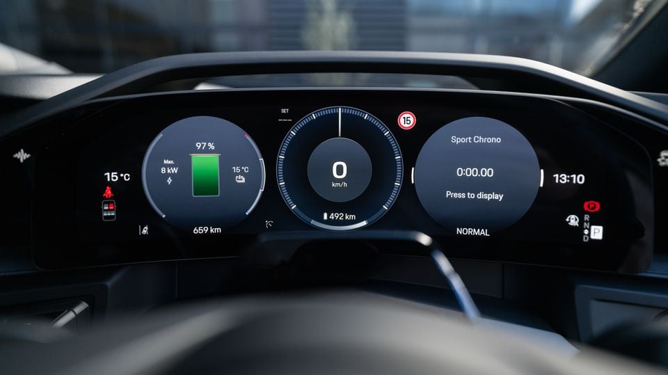 Digital instrument cluster of a Porsche Cayenne S Electric showing battery charge at 97%, 659km range, Sport Chrono timer, and 0 km/h speed display