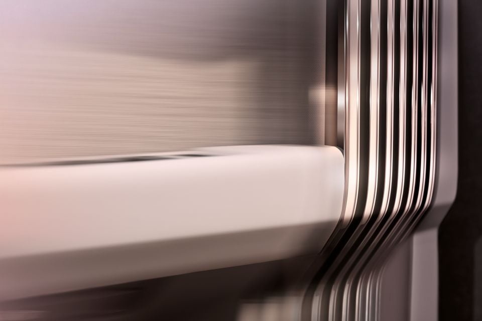 Close-up of a car door panel showing layered chrome trim detailing and a smooth body line, likely on a Range Rover GT