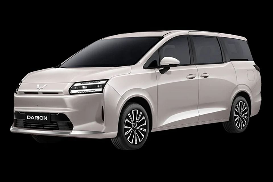 A beige Wuling Darion MPV shown from the front quarter angle against a black background